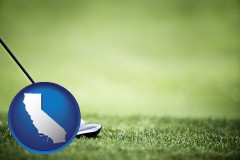 california map icon and a golf ball and a golf club on a golf course