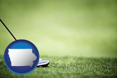 iowa map icon and a golf ball and a golf club on a golf course