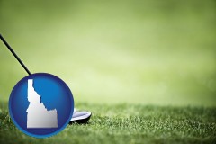 idaho map icon and a golf ball and a golf club on a golf course