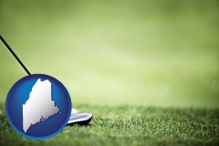 maine map icon and a golf ball and a golf club on a golf course