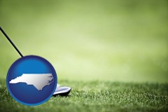 north-carolina map icon and a golf ball and a golf club on a golf course