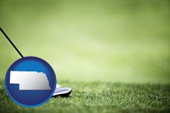 nebraska map icon and a golf ball and a golf club on a golf course