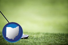 ohio map icon and a golf ball and a golf club on a golf course
