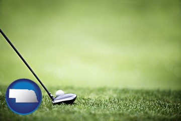 a golf ball and a golf club on a golf course - with Nebraska icon