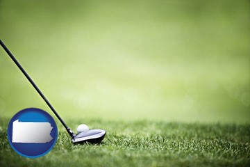 a golf ball and a golf club on a golf course - with Pennsylvania icon